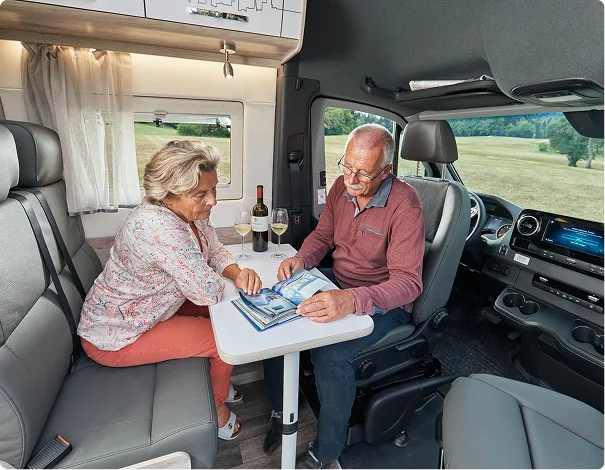 Couple relaxing inside a motorhome